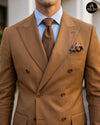 Close view of caramel brown double breasted suit lapel and tie - Abito Men