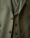 Close view of sage green suit buttons and waistcoat detailing - Abito Men